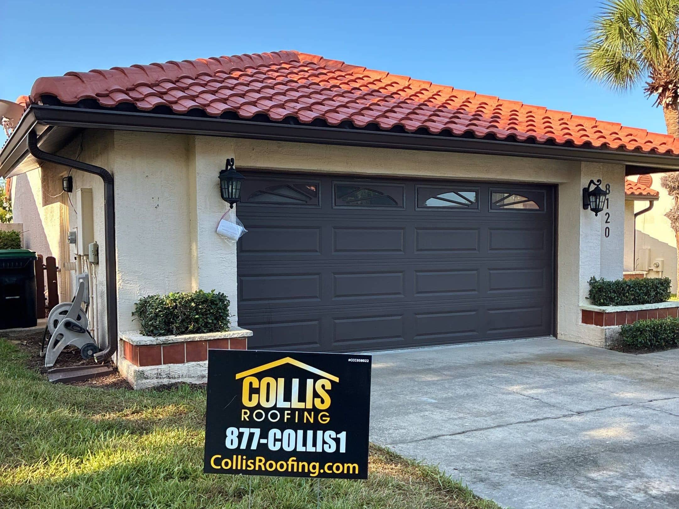 Collis Roofing Yard Sign on completed tile roof repair.